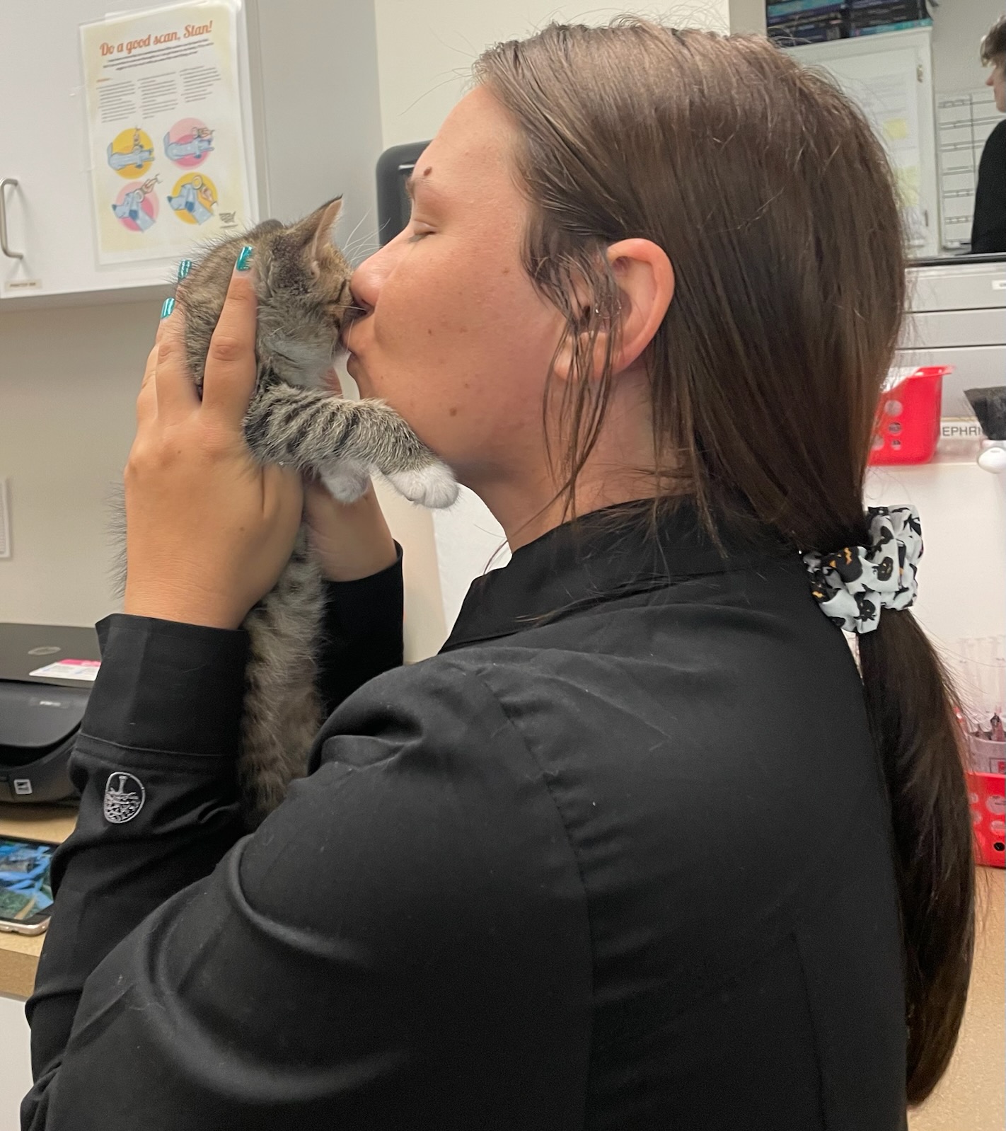 image(22) stringtown-animal-hospital-vet-tech-kissing-kitten