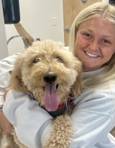 Vet Assistant with Big Curly Dog